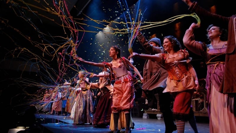 Performers celebrating on stage.