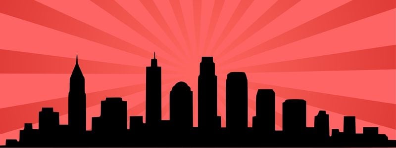 NYC silhouette on a red background.