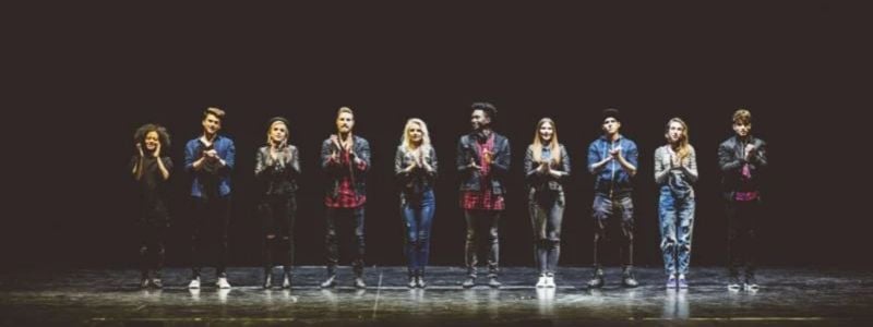 A group of high school students on stage.