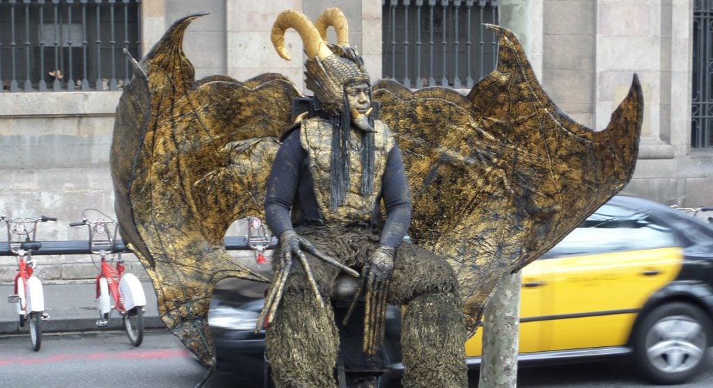 A costumed man performing on the streets of Barcelona.