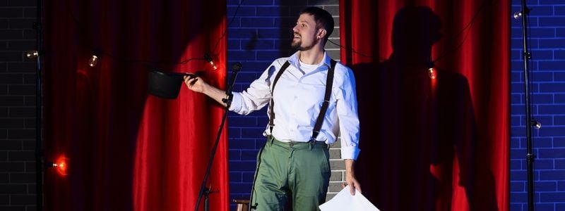 A man in costume on stage.