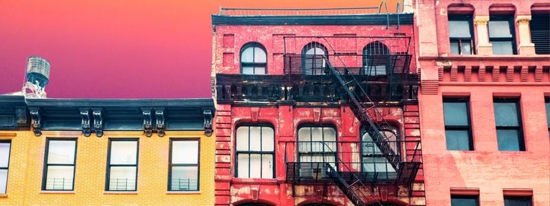 The tops of three NYC buildings.