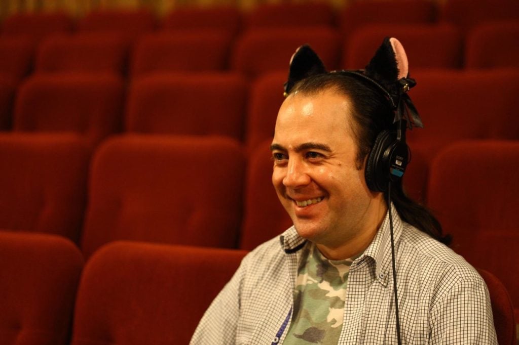 Kai Harada smiling at work.