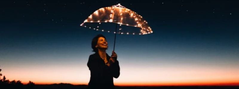 A woman with a magical umbrella.