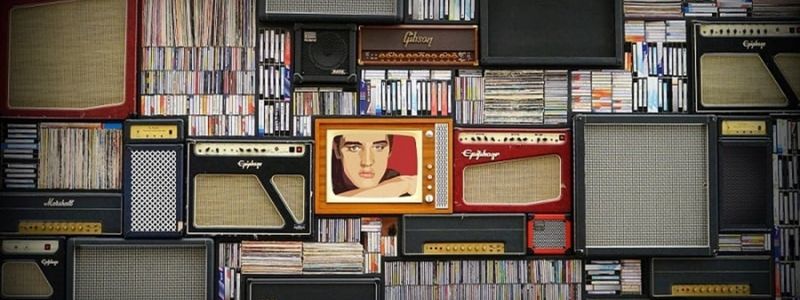 Vintage records and speakers on shelves.