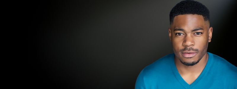 A headshot of CJ Stewart.