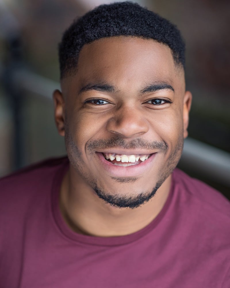 Headshot of CJ Stewart.