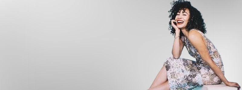 A headshot of Afra Hines.