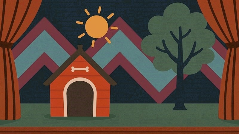 A doghouse, tree, and sun on stage.