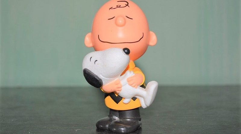 Charlie Brown with Snoopy.