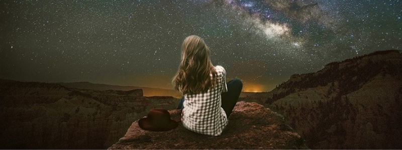 A woman looking at the stars.