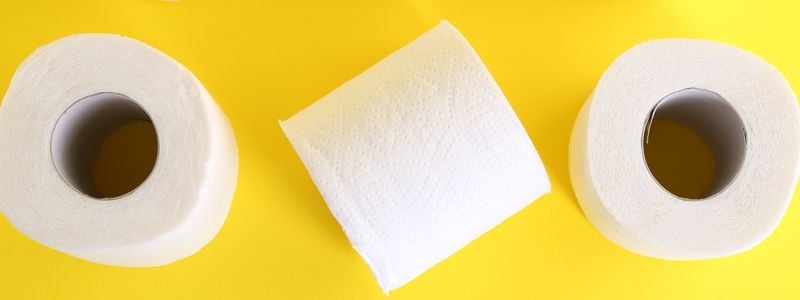 Toilet paper on a yellow background.