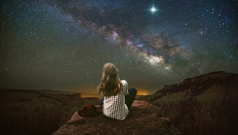 A woman looking at the stars.