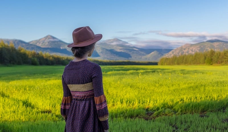 A woman looking at the hills.