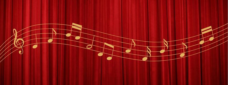 Golden music notes in front of a red stage curtain.