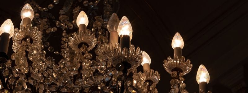A chandelier with a dark background.
