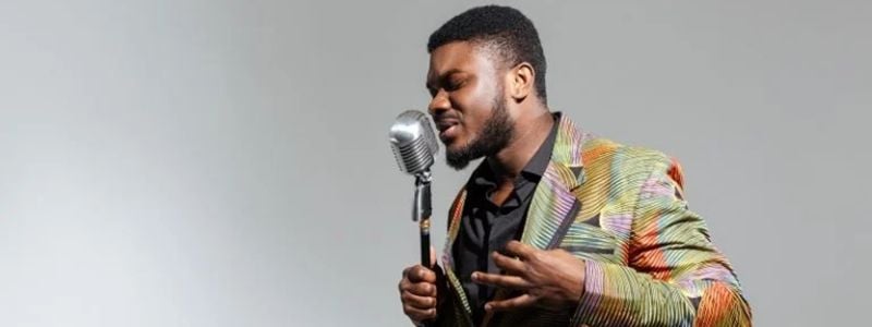A man singing into a microphone.