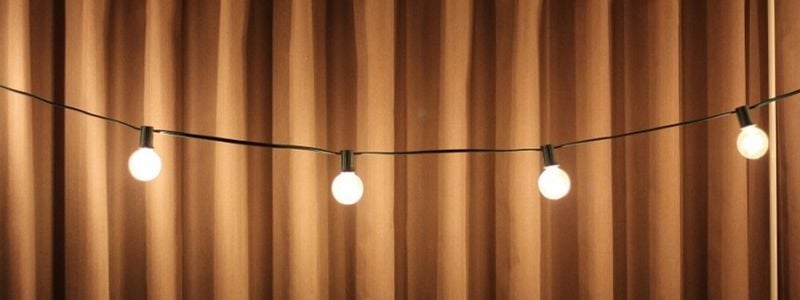 Stage curtains and string lights.