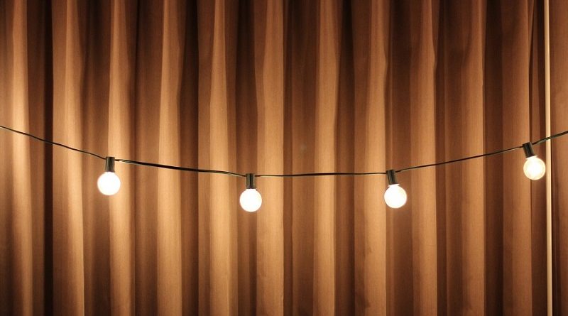 Stage curtains and string lights.
