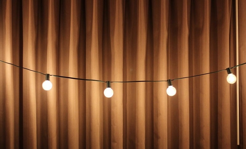 Stage curtains and string lights.