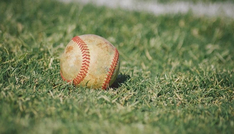 A baseball on a field.