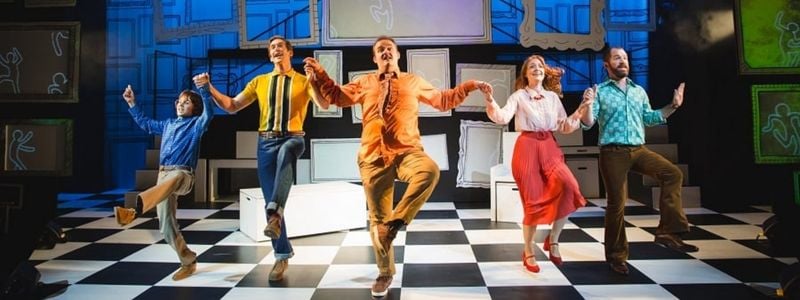 The cast of Falsettos on stage.
