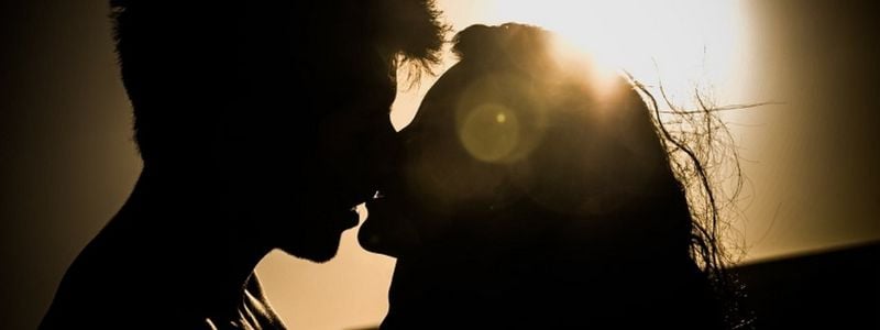 A kissing couple silhouette.