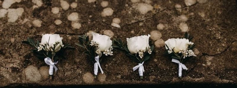 Four creepy prom boutonnieres.