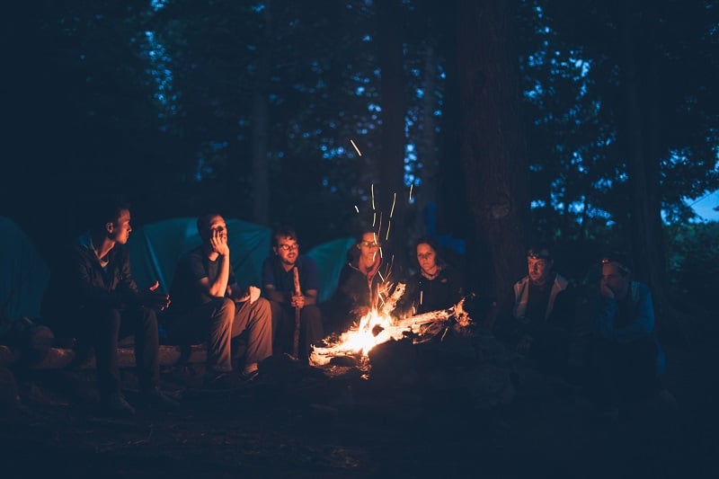 Campers around a fire.