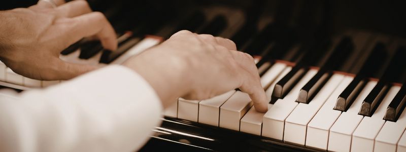 Hands at the piano.