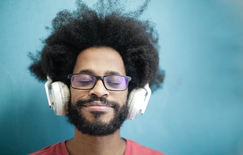 A man listening to music on headphones.