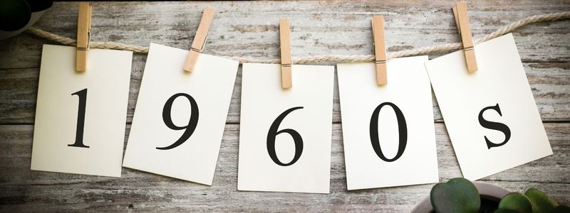 The numbers "1960s" hanging on a clothes line.