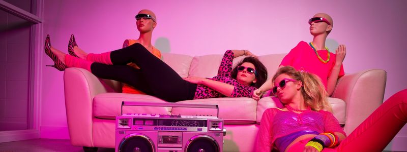 1980s style women lying around with a boombox.