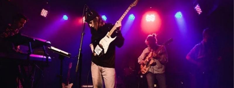 A rock guitarist on stage.