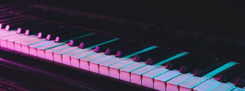 Neon lit piano keys.
