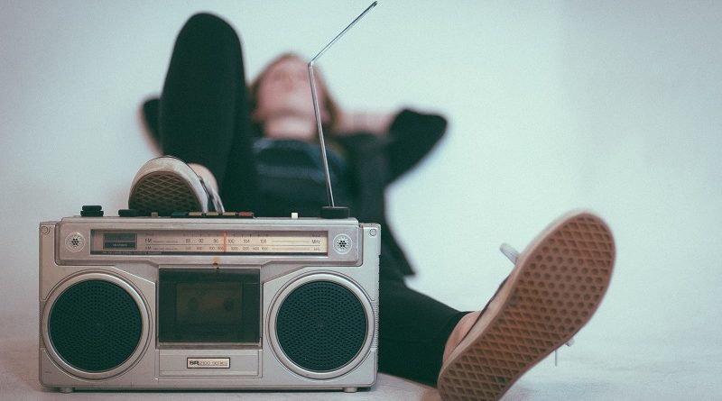 Someone relaxing with a stereo.