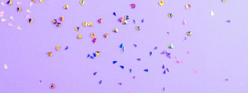 Confetti on a purple background.