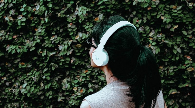 A woman listening to music.