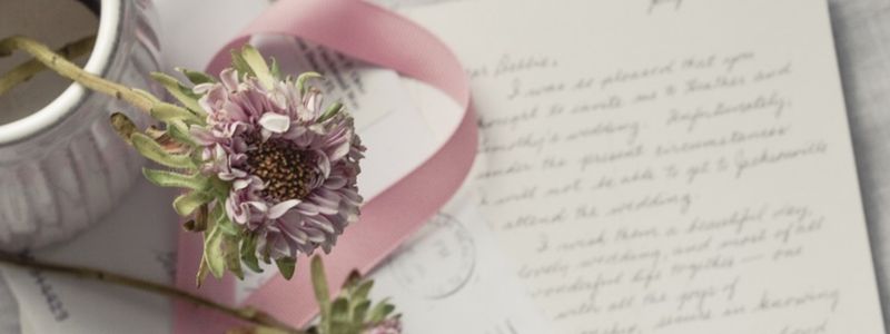 Pink flowers and hand-written letters.