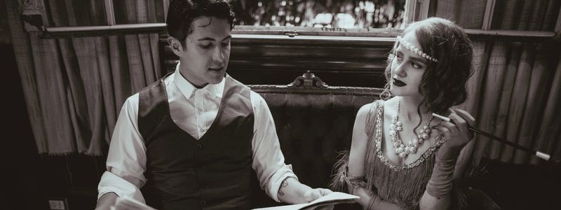 A 1920s couple reading the paper.