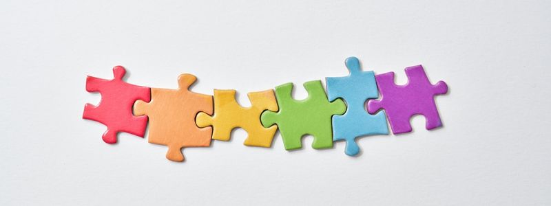Six colorful puzzle pieces.