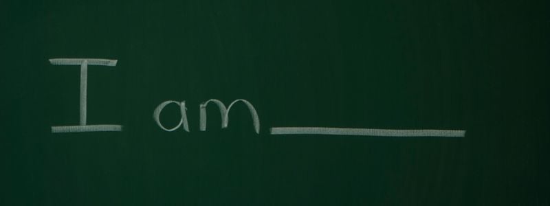 "I Am..." written on a chalkboard.