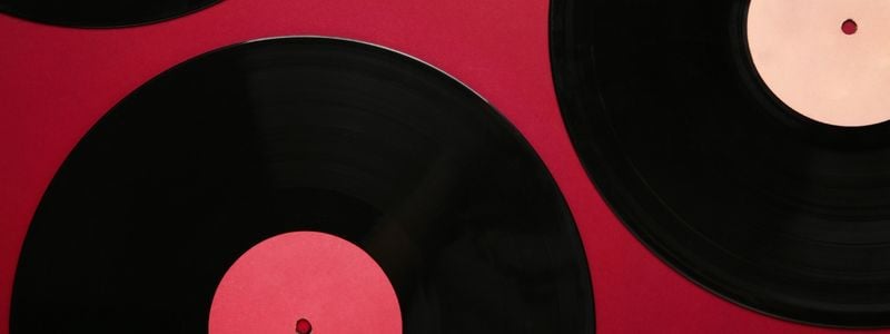 Gramophone records on a red background.