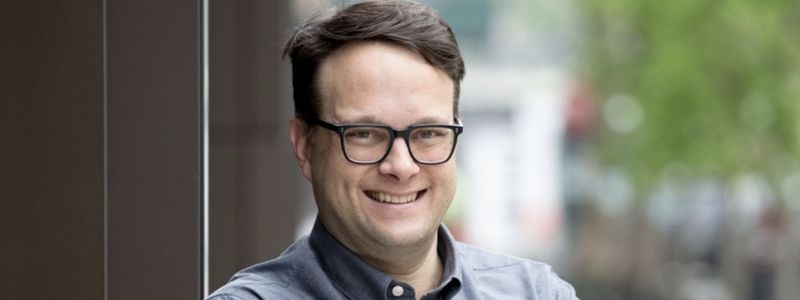 A headshot of Tyler Micoleau.