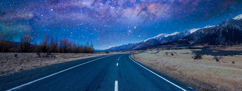 A long road and starry night.