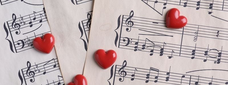 Sheet music with little hearts on top.