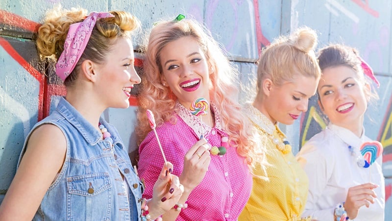 Four 1950s ladies with lollipops.