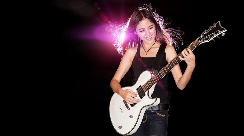 A female rocker with a guitar.