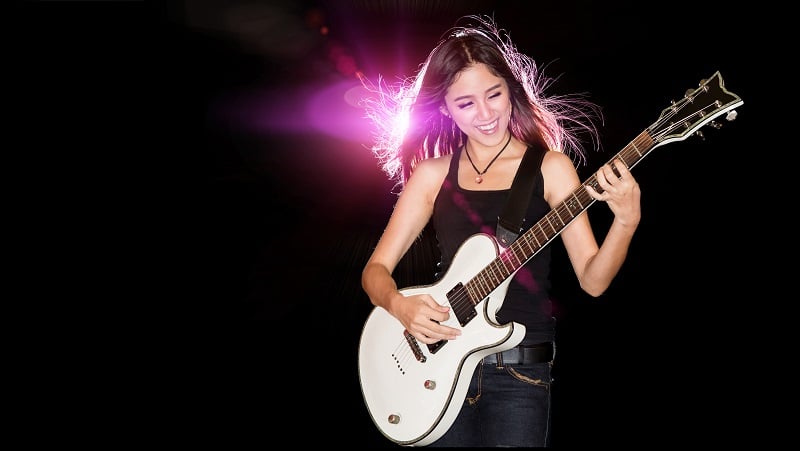 A female rocker with a guitar.