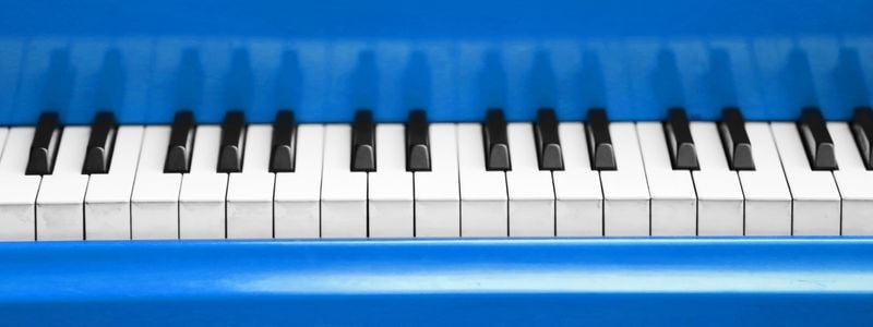 A bright blue piano.